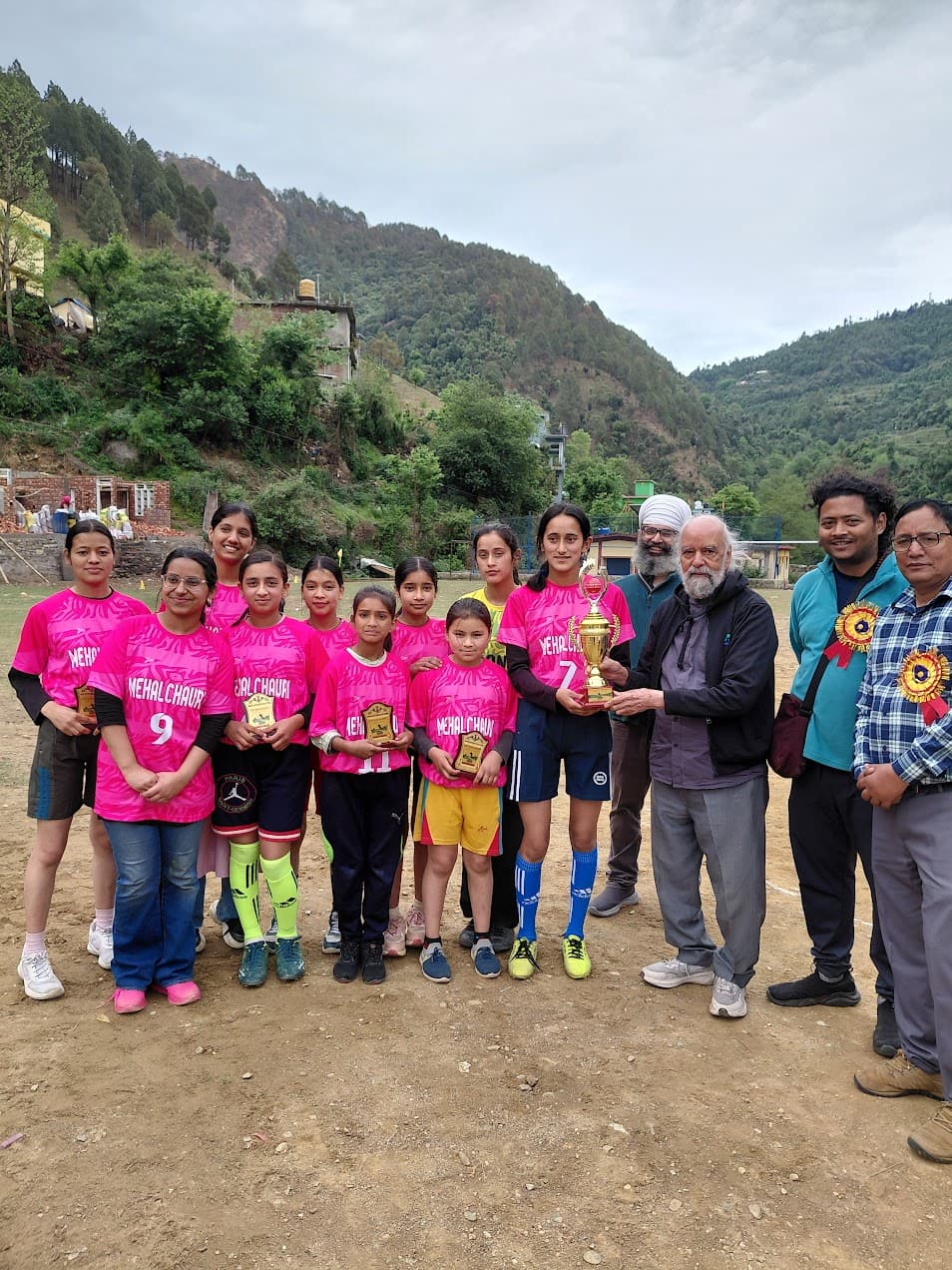Prof. S. K. Palhan presenting the trophy to Mehalchauri-Salinga's first girls' football team