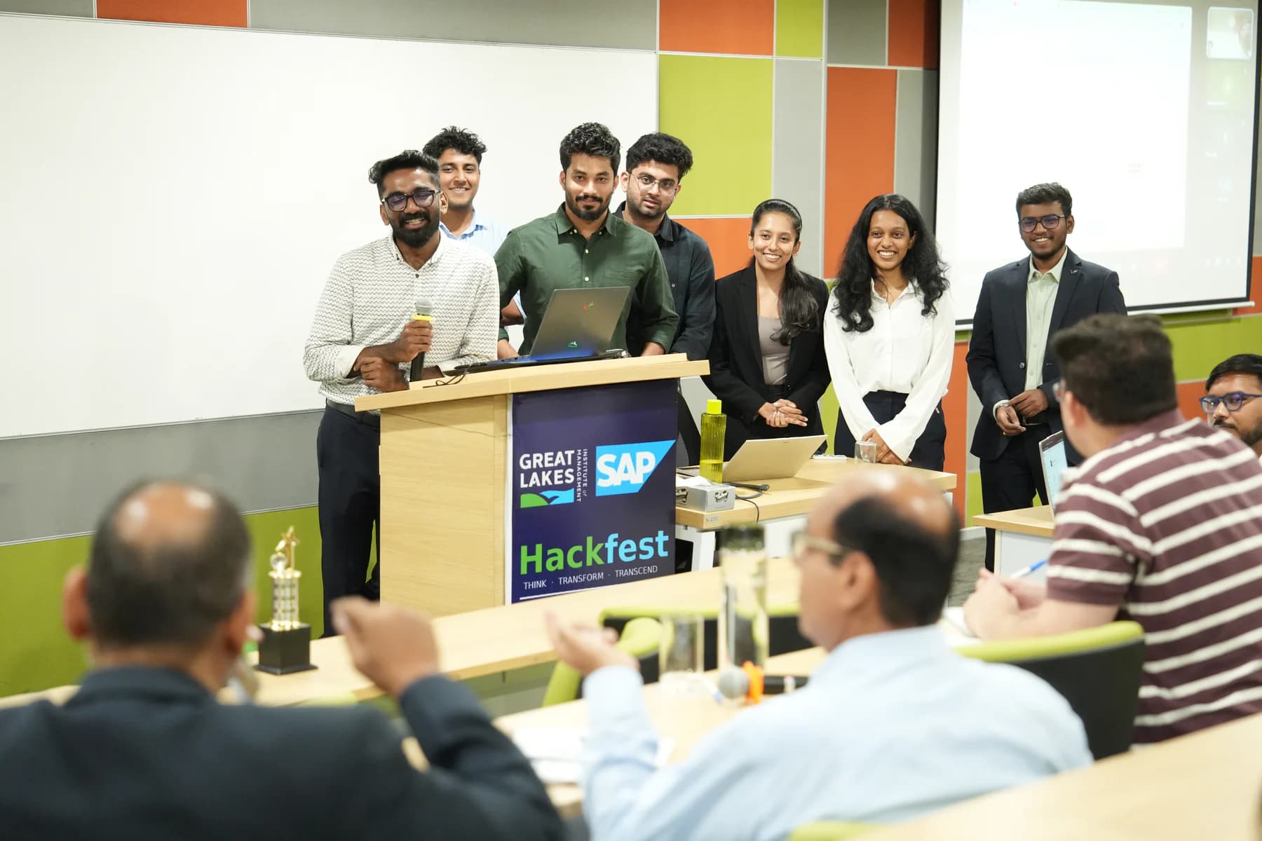 A student team presenting its work to a live audience and review panel