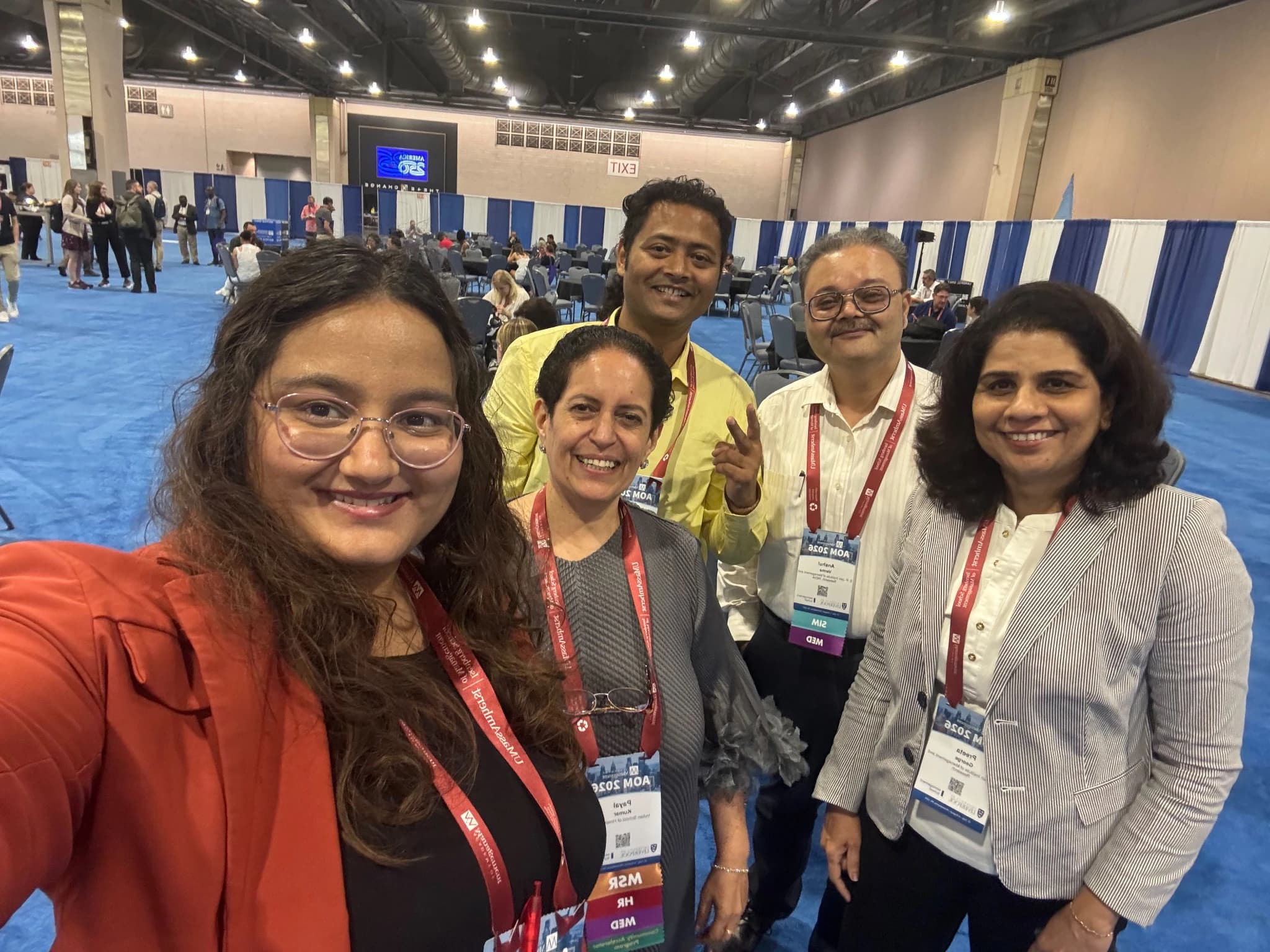 Swapnil Sahoo with four fellow Academy of Management attendees at AOM 2026 in the Philadelphia Convention Center