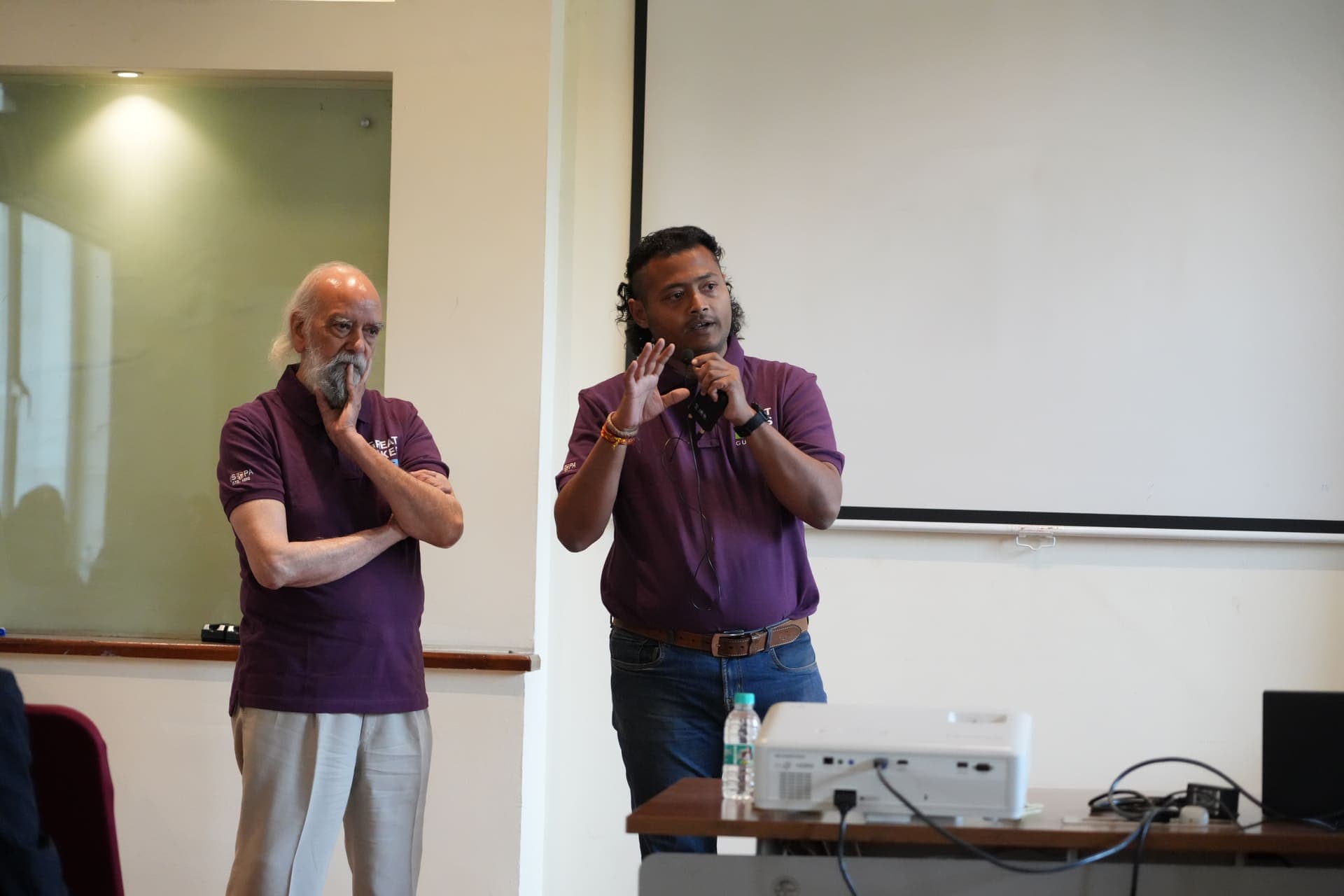Dr Swapnil Sahoo speaking mid-gesture alongside a colleague during a faculty workshop at Great Lakes Gurgaon