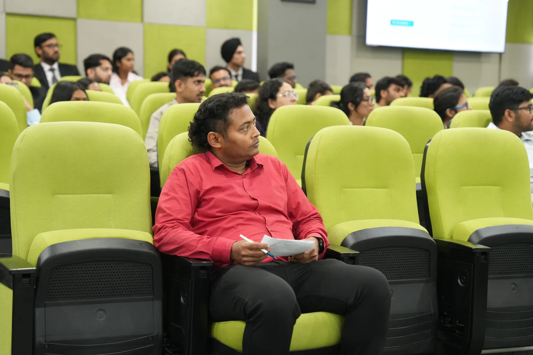 Dr Swapnil Sahoo seated among the incoming PGPM cohort during induction, taking notes